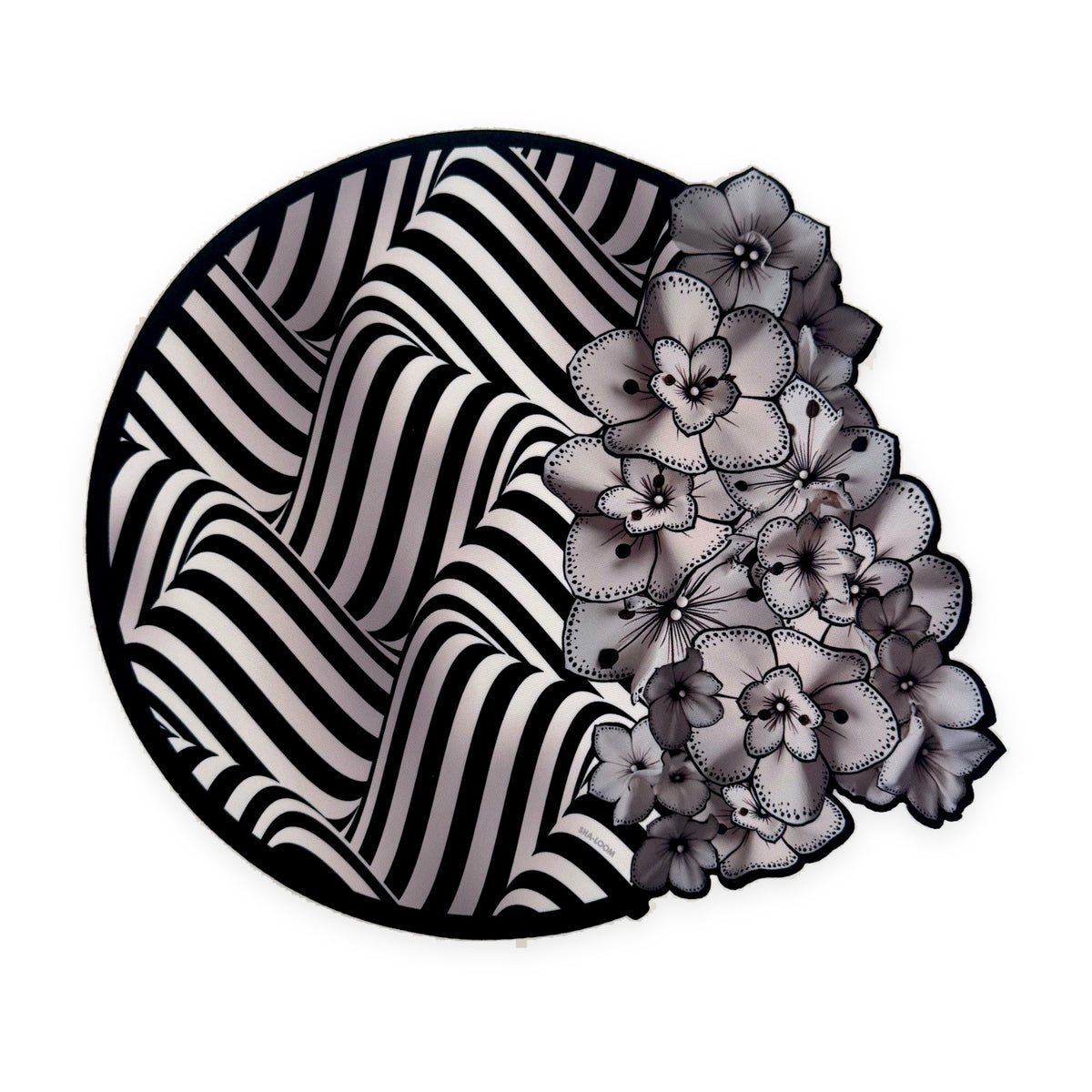 Midnight Illusion die-cut placemat by Shaloom Living, black and white op-art stripes with orchids