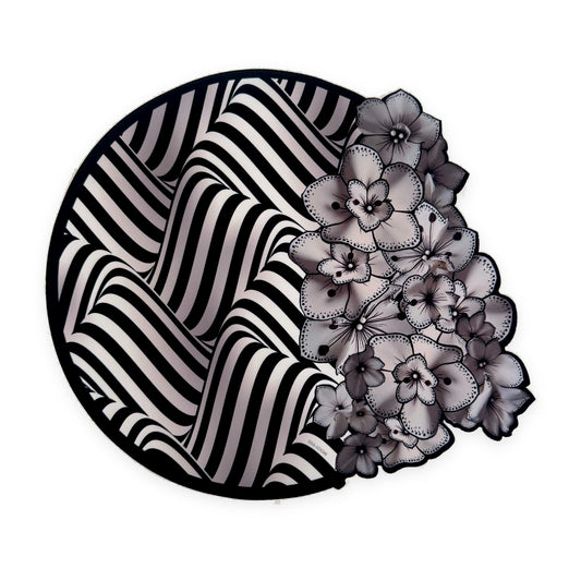 Midnight Illusion die-cut placemat by Shaloom Living, black and white op-art stripes with orchids
